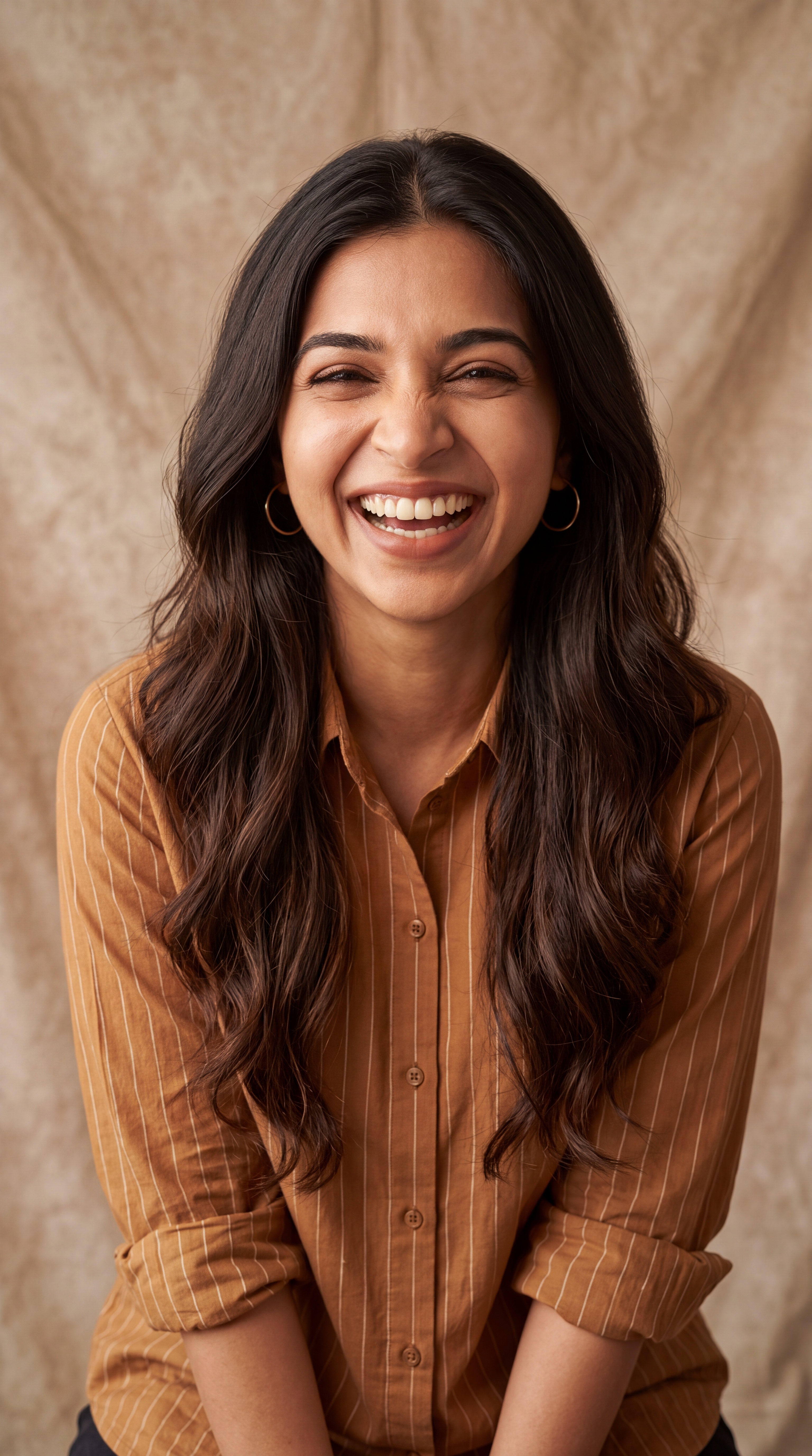 Asian woman in brown shirt